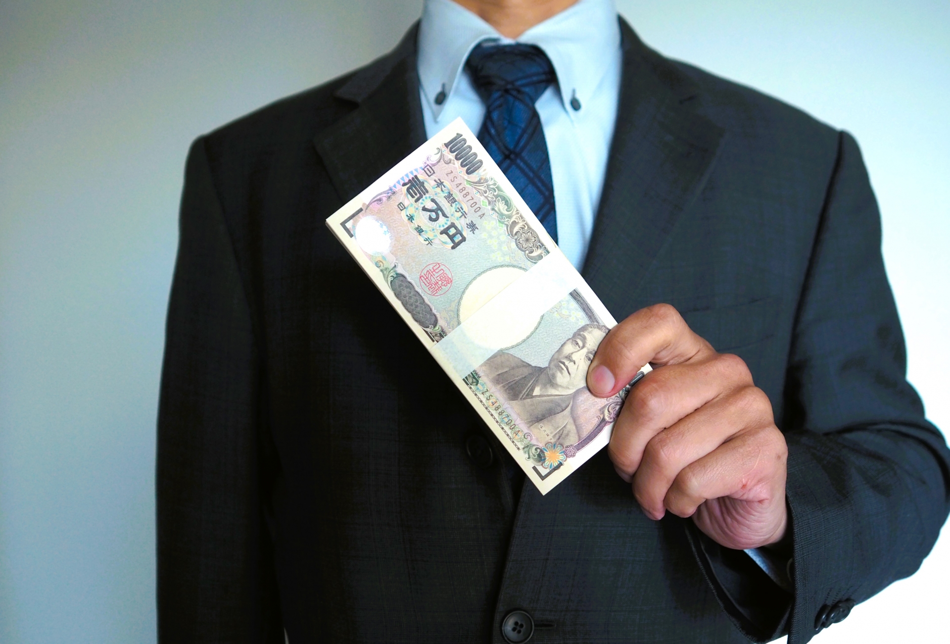 サラリーマンと札束で給料